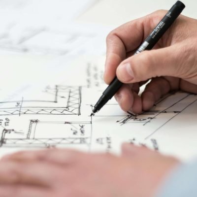 nieuwbouw Person Holding Black Pen